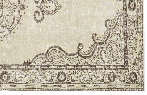 Load image 1 in gallery view. Beige and brown rug with a distressed traditional medallion pattern and a detailed geometric border.