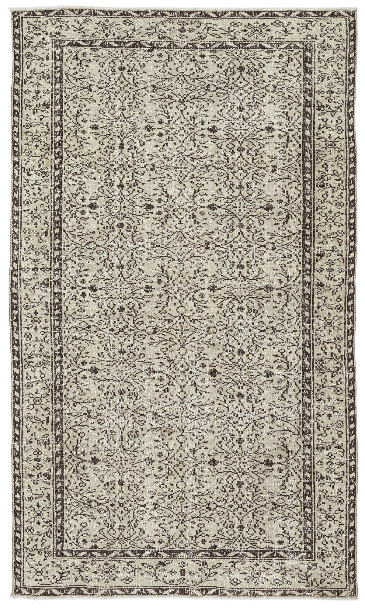 Beige and dark brown vintage-style rug with an intricate floral medallion pattern and a decorative geometric border.