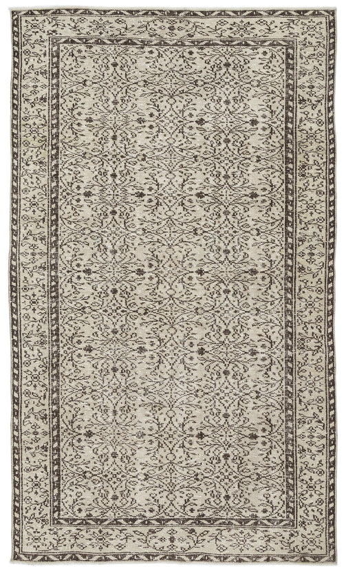 Load image 1 in gallery view. Beige and dark brown vintage-style rug with an intricate floral medallion pattern and a decorative geometric border.