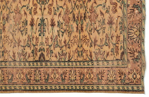 Load image 1 in gallery view. Tan, brown, and sage green traditional rug with a distressed floral motif and a geometric border.