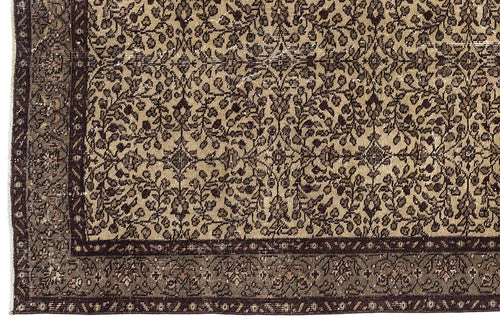 Load image 1 in gallery view. Beige and dark brown rug with an intricate floral vine pattern and a wide, detailed border.