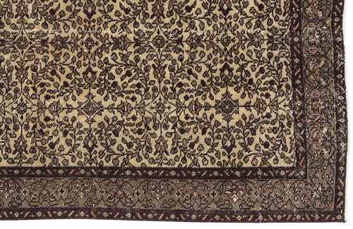 Load image 1 in gallery view. Tan and dark brown traditional rug with an intricate floral vine pattern and a wide, detailed border.