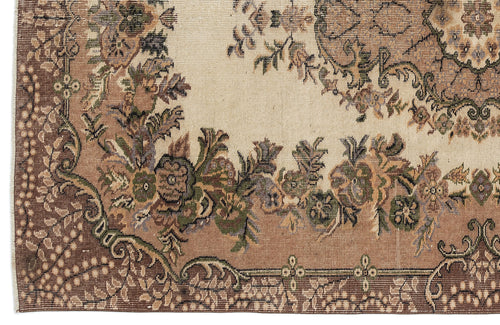 Load image 1 in gallery view. Beige and brown traditional rug with a floral medallion pattern and intricate decorative borders.