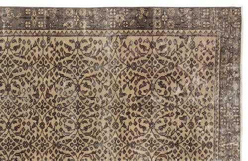 Load image 1 in gallery view. Tan and dark brown traditional rug with a distressed floral medallion pattern and a wide decorative border.