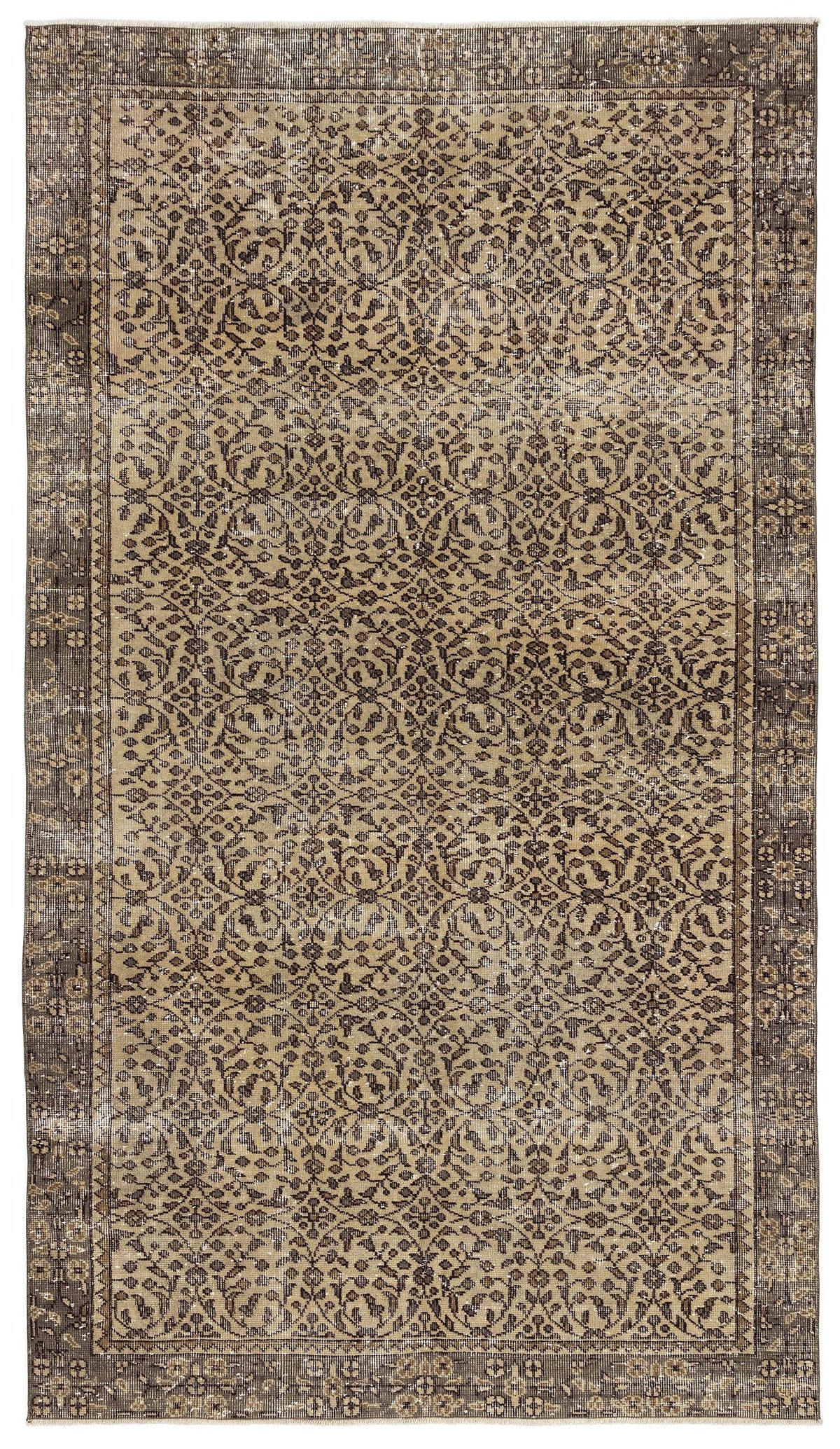Distressed brown and tan rug with a traditional floral medallion pattern and a wide decorative border.