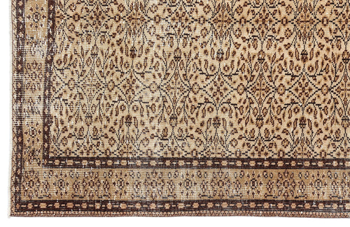 Load image 1 in gallery view. Tan and dark brown vintage-style rug with an intricate floral medallion pattern and a geometric border.
