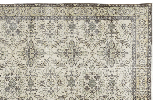 Load image 1 in gallery view. Beige and dark brown rug with a distressed traditional floral medallion pattern and a decorative border.