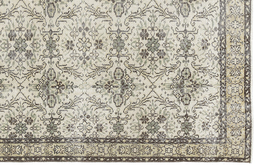 Load image 1 in gallery view. Cream and charcoal grey rug with a distressed traditional floral medallion pattern and a detailed border.
