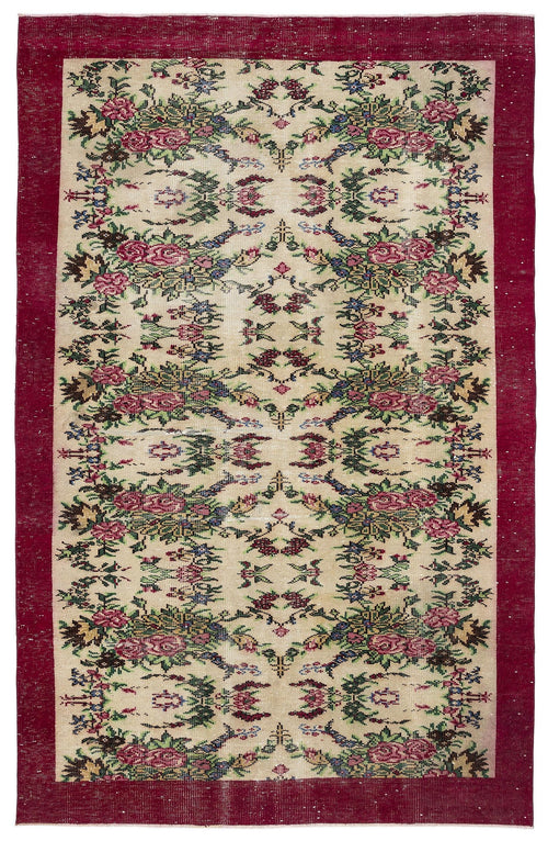 Load image 1 in gallery view. Beige rug with a deep red border and a symmetrical floral pattern in pink, green, and blue on a white background.