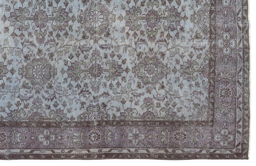 Load image 1 in gallery view. Distressed slate blue and charcoal grey rug with a traditional floral medallion pattern and a wide decorative border.