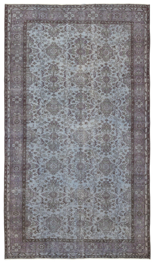 Load image 1 in gallery view. Muted blue and charcoal grey vintage-style rug with a distressed traditional floral medallion pattern and border.
