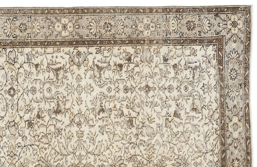 Load image 1 in gallery view. Beige and brown traditional rug with a distressed floral medallion pattern and a detailed border.