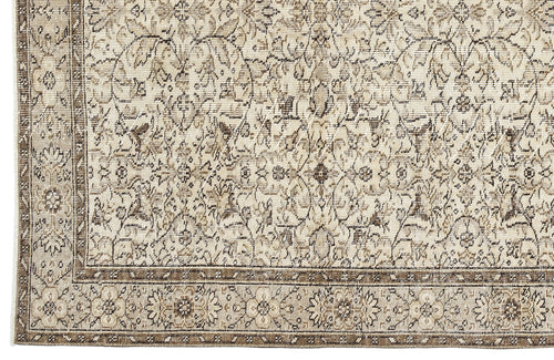 Load image 1 in gallery view. Beige and brown traditional rug with a distressed floral medallion pattern and a detailed border.