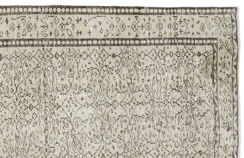 Load image 1 in gallery view. Beige and dark brown rug with a distressed traditional medallion pattern and a geometric border.