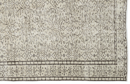 Load image 1 in gallery view. Beige and dark brown rug with a distressed traditional medallion pattern and a detailed geometric border.