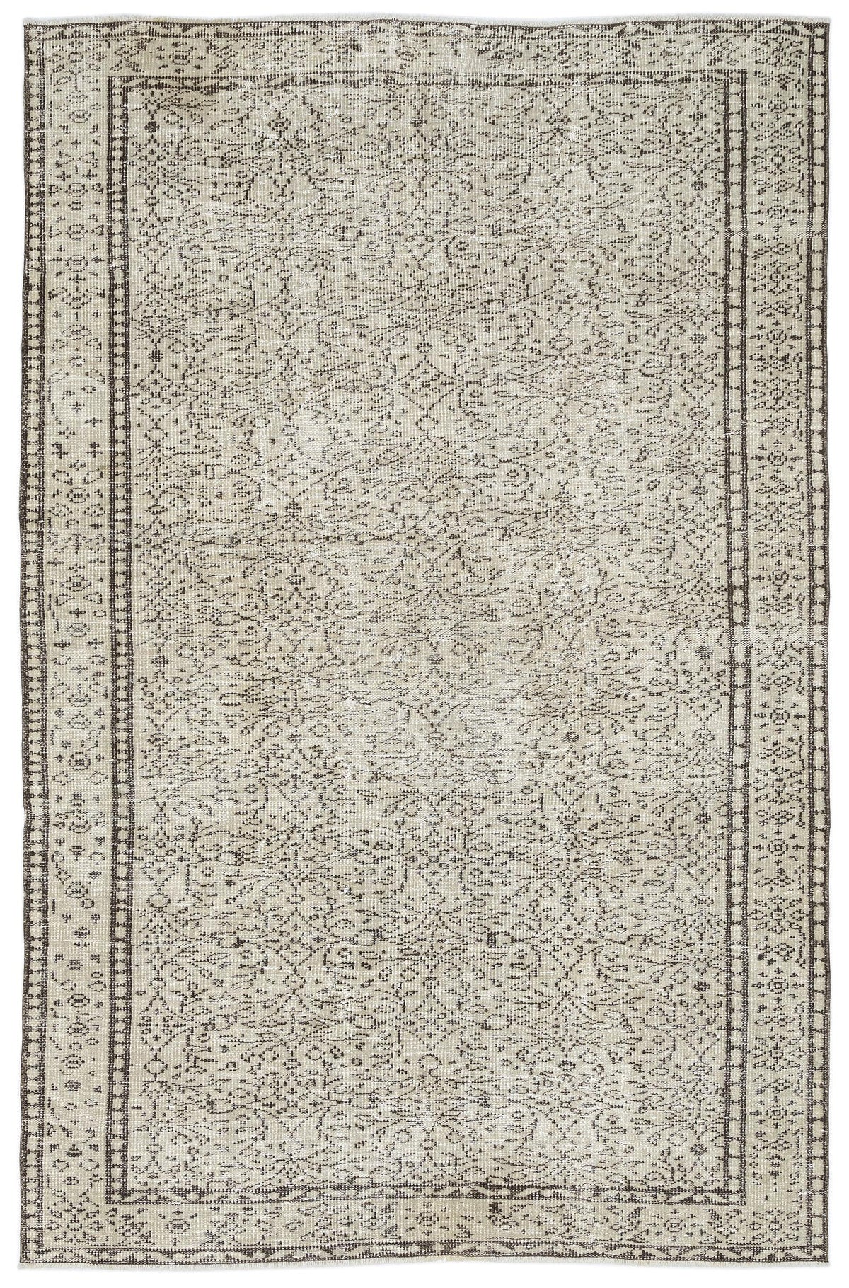 Beige and dark brown vintage-style rug with a distressed, intricate floral medallion pattern and a geometric border.