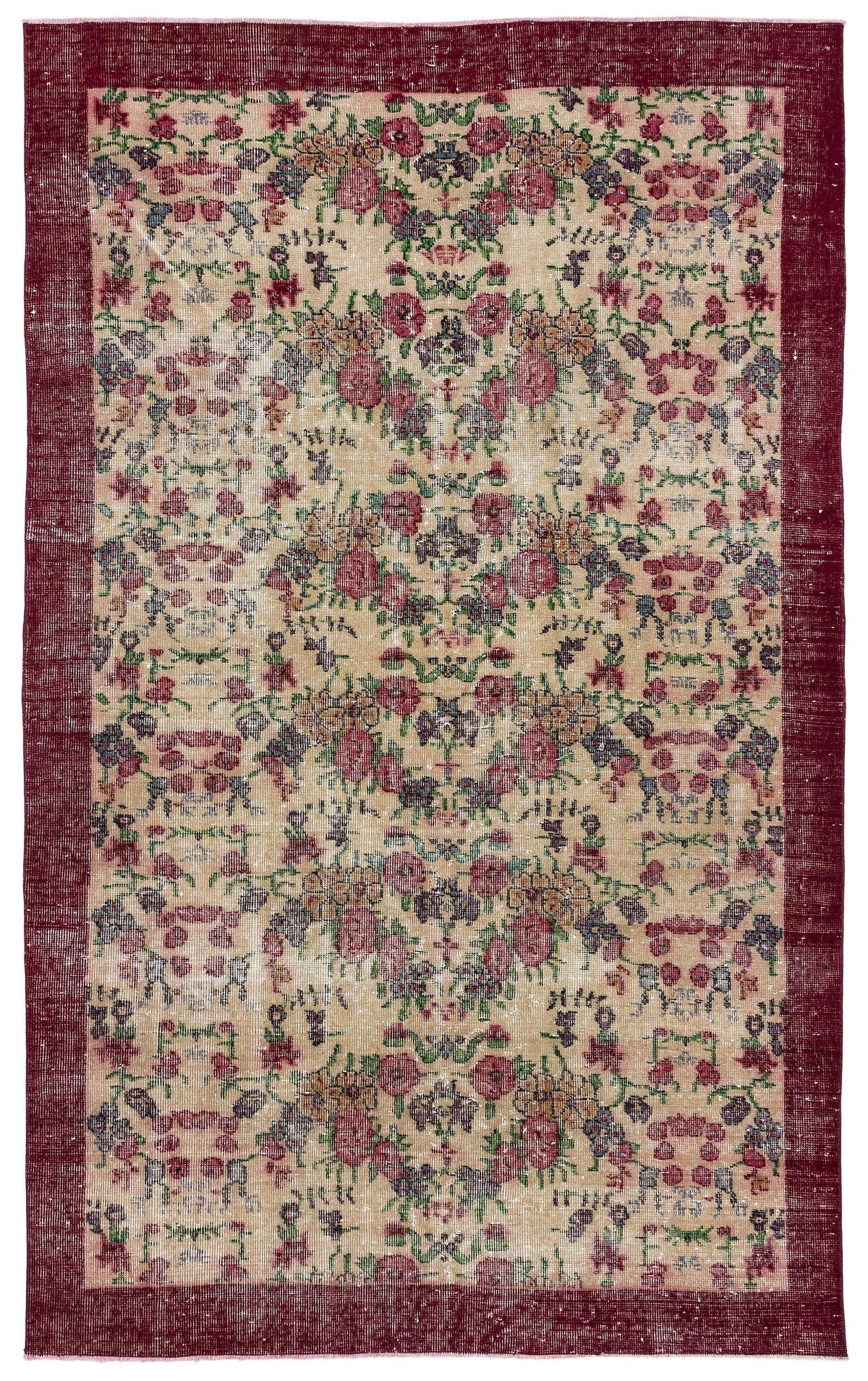 Beige rug with a distressed floral pattern in red, green, and blue, featuring a wide solid dark red border.