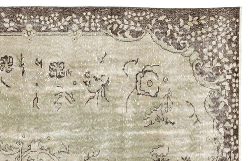 Load image 1 in gallery view. Distressed sage green and brown rug with a faded floral medallion pattern and ornate border on a white background.