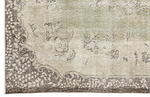Load image 1 in gallery view. Sage green and brown distressed rug with a traditional floral medallion pattern and ornate border.