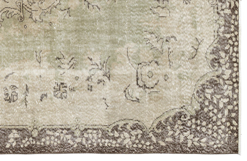 Load image 1 in gallery view. Sage green and beige distressed rug with a dark brown floral border and traditional medallion pattern.
