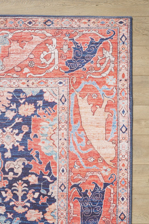 Bild 1 in Galerieansicht laden. A close-up of the Aegis Handmade-Design Washable Rug - LCC3029, featuring intricate coral, navy blue, cream, and pink patterns on a light wood floor—ideal for high-traffic areas.