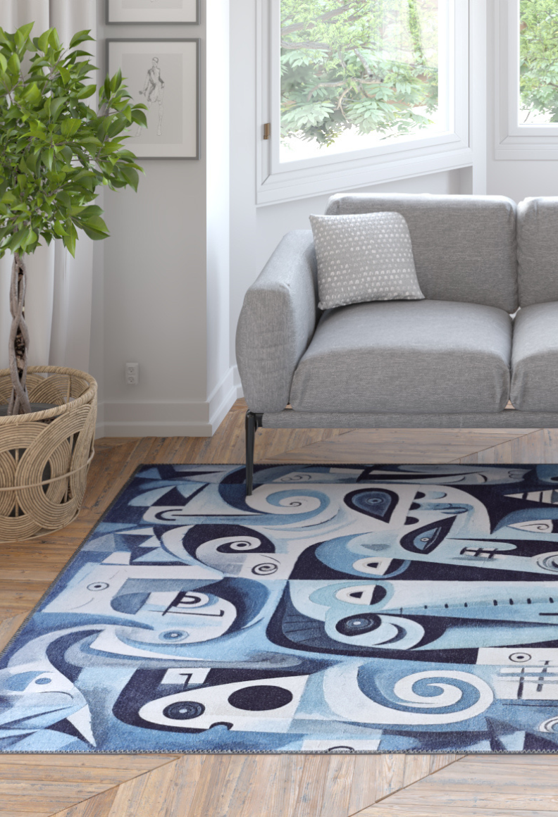 A modern living room with a gray sofa, patterned pillow, potted plant, wood floor, and the Aesthetic Anomaly Contemporary Washable Rug - MDJ004 (Custom Size) in blue—its geometric design is perfect for high-traffic spaces with views of lush greenery.