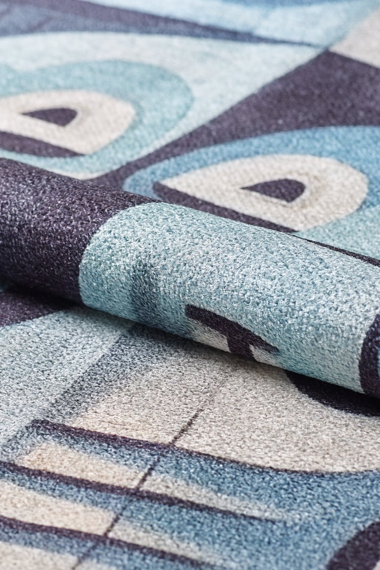 Close-up of the Aesthetic Anomaly Contemporary Washable Rug - MDJ004 (Custom Size) in blue, cream, and dark gray with an abstract geometric pattern—ideal for high-traffic areas thanks to its durable textured design.