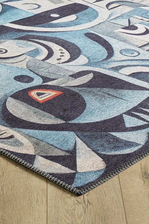 Load image 1 in gallery view. A corner of the Aesthetic Anomaly Contemporary Washable Rug - MDJ004 (Custom Size) in blue, featuring abstract gray, black, and red geometric patterns on a light wooden floor—perfect for high-traffic areas.
