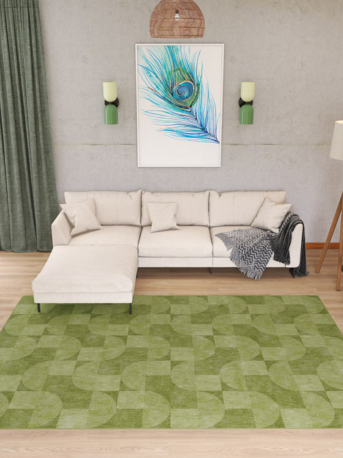 Load image 1 in gallery view. A modern living room with a cream sectional sofa, green curtains, peacock feather wall art above the sofa, two green wall sconces, a floor lamp, and the Aged Serenity - Washable Rug - JRN51 with a chic geometric pattern.