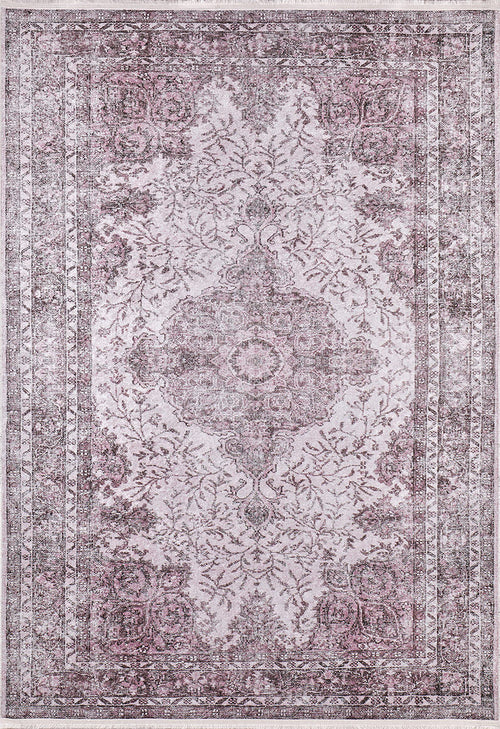 Load image 1 in gallery view. The Ancient Emblem - Washable Rug - JR200 is a rectangular, vintage-style rug with a faded floral and geometric pattern in muted mauve, pink, and gray tones. It’s washable and ideal for high-traffic areas, featuring a central medallion and ornate borders.