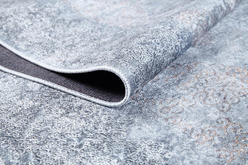 Load image 1 in gallery view. A close-up of the Ancient Treasure - Washable Rug - JR1785 (Custom Size) in gray and light blue with intricate swirling designs, showing its underside and texture—perfect for high-traffic areas.