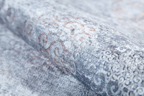 Load image 1 in gallery view. A close-up of Ancient Treasure - Washable Rug - JR1785 (Custom Size), featuring a textured light gray and silver surface with subtle ornate swirls—ideal for pairing with blue decor in high-traffic spaces.