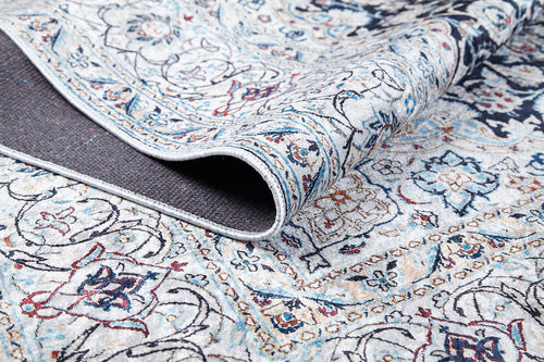 Load image 1 in gallery view. A close-up of the Antique Enchantment - Washable Rug - JR1686 (Custom Size) displays its light, intricate floral and geometric flat weave pattern with a flipped corner revealing the dark textured backing.