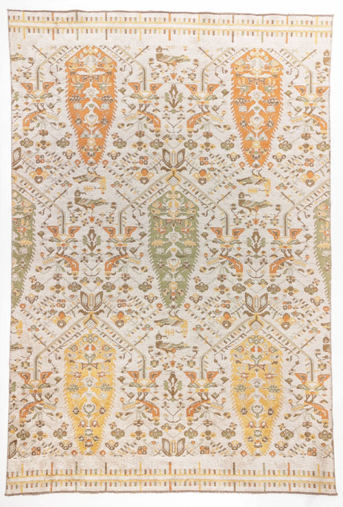 Load image 1 in gallery view. 
Saffron Heritage area rug with cream ground and orange, gold, and sage green paisley boteh motifs