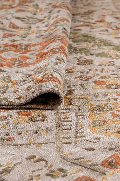 Load image 1 in gallery view. A close-up of the Saffron Heritage Area Rug APX1912 shows its intricate, colorful pattern in orange, green, and gold on a beige background. The texture and flatwoven construction are clearly visible.