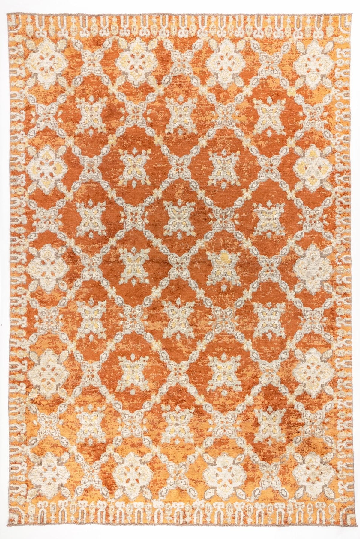 Amber Trellis area rug with burnt orange field and ivory lattice pattern featuring distressed floral motifs