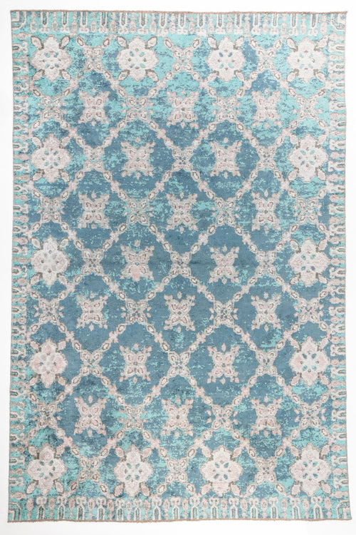 Load image 1 in gallery view. Ocean Trellis area rug with deep teal blue field and ivory lattice pattern with distressed floral motifs