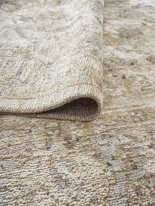 Load image 1 in gallery view. A close-up of the Stone Garden Area Rug APX1961, slightly folded at one corner, highlights its textured weave and subtle color variations for a vintage-inspired look.