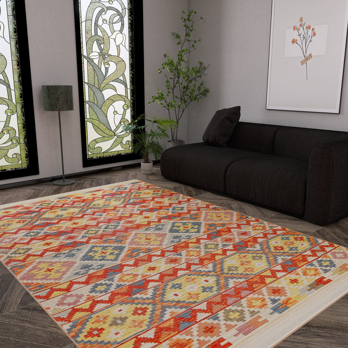 A modern living room with a dark sofa, the Aqua Flow - Washable Reversible Kilim - NMD02 area rug, a floor lamp, potted plant, stained glass windows, and a framed botanical print on a gray wall.