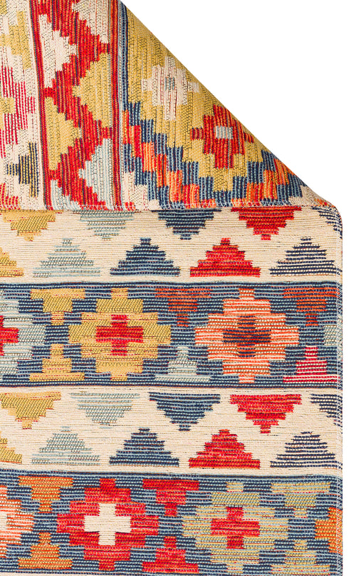 Bild 1 in Galerieansicht laden. The Aqua Flow - Washable Reversible Kilim - NMD02 features a colorful Southwestern geometric diamond pattern in red, blue, yellow, and cream, partially folded at one corner to showcase its reversible design.