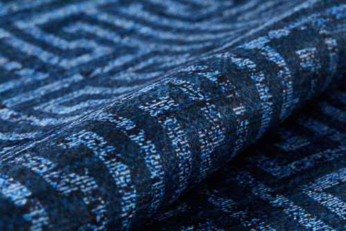 Load image 1 in gallery view. A close-up of the Art Deco Elegance - Washable Rug - JR1224 (Custom Size) reveals intricate interlocking geometric lines and shapes in blue and black. Its detailed texture makes this washable rug perfect for high-traffic areas.
