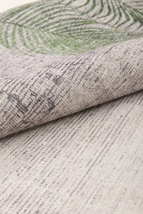 Load image 1 in gallery view. A close-up of the Ashwing Silence - Washable Rug - JR0048 shows textured beige fabric with thin, uneven dark lines and a green leaf pattern partially visible at the top edge.