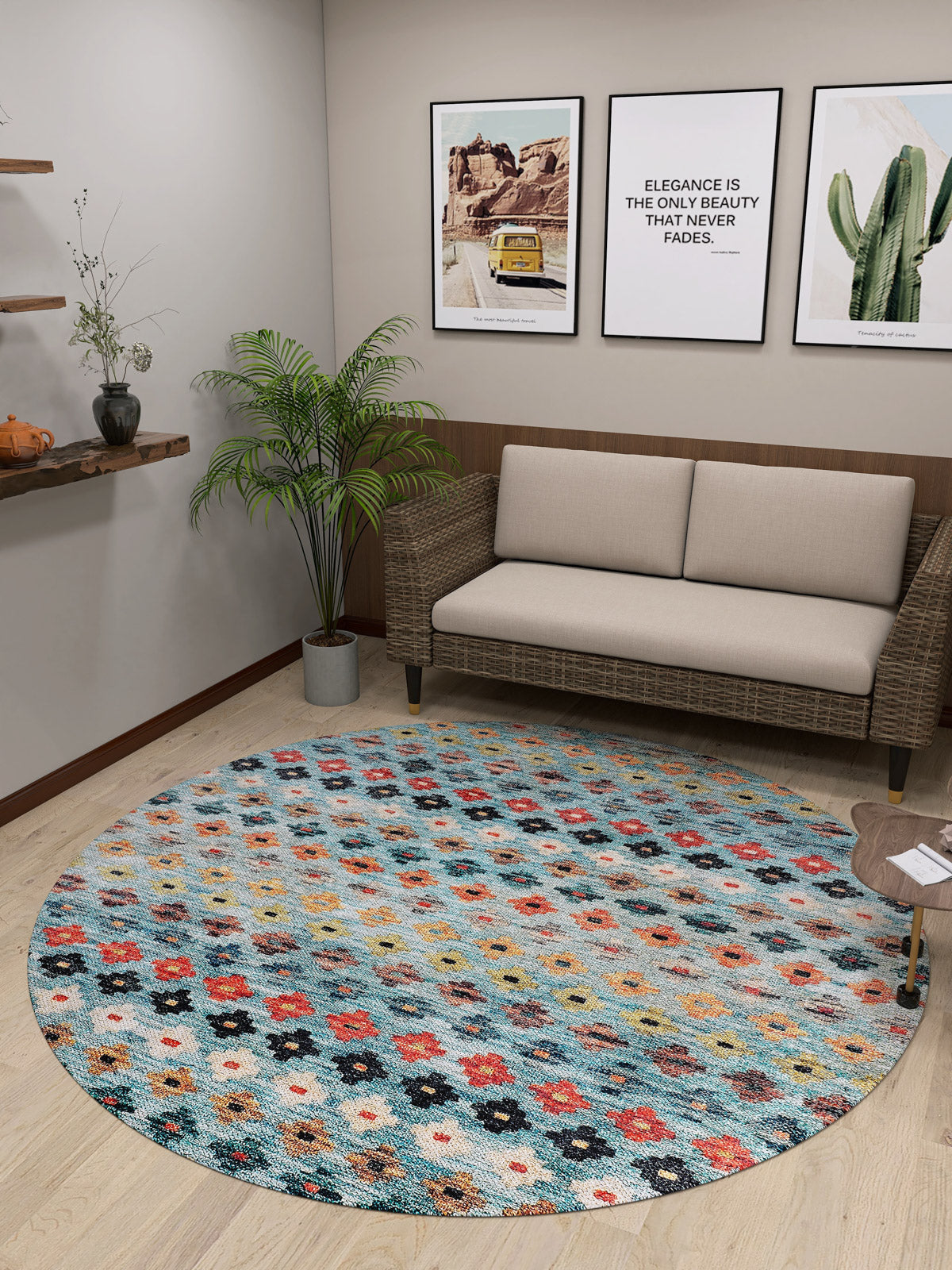 A cozy room with a beige loveseat, a potted plant, framed cactus and quote wall art on cream walls, and the Aztec Ambience - Washable Rug - JR1086 (Custom Size) featuring a multicolor geometric pattern—great for high-traffic areas.