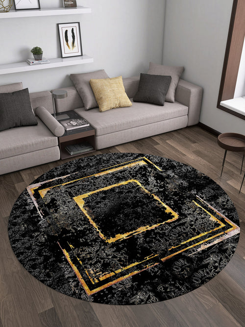 Load image 1 in gallery view. A modern living room with a gray sectional, yellow accent pillow, round table, and the Azure Glow - Washable Rug - JR1337 featuring abstract yellow and gold geometric patterns—stylish and ideal for high-traffic spaces on dark wood flooring.