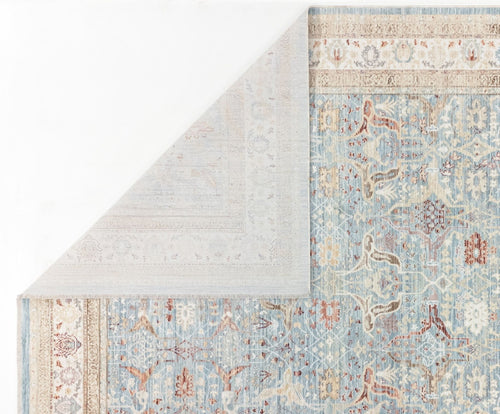 Load image 1 in gallery view. The Azure Oushak - Area Rug - APX2932 features a light blue Persian pattern with cream, beige, and brown accents, shown partially folded to display its lighter underside and intricate border designs.