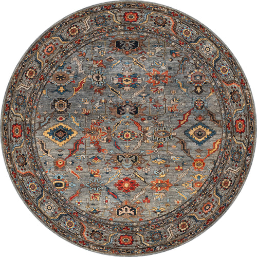 Load image 1 in gallery view. The Bellaris Gray Washable Rug - LCC3003 features a round shape and a detailed geometric and floral pattern in blue, red, gold, and beige with a decorative border—perfect for allergy-sensitive or high-traffic areas.