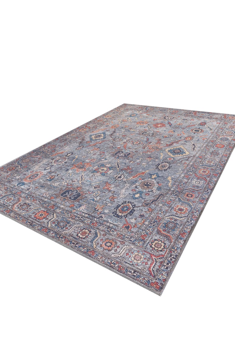 The Bellaris Gray Washable Rug - LCC3003 (Custom Size) features a detailed pattern in blue, red, orange, and cream tones, shown on a white background from a low side angle.
