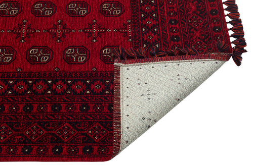 Load image 1 in gallery view. The Berry Pattern - Kilim - BHR04 is a red Turkish chenille-polyester rug with black and white geometric designs, fringed edges on one side, and a partially folded corner showing its light gray, speckled underside.