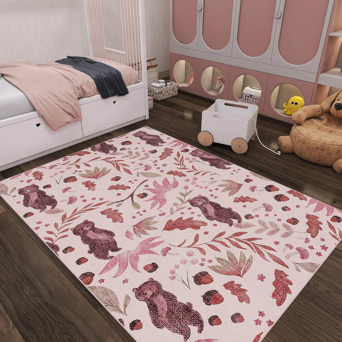 Light pink rug with a pattern of bears, acorns, and leaves, styled in a child's bedroom.