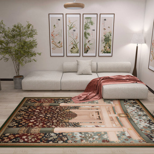 Load image 1 in gallery view. A modern living room with a white sectional sofa, single cushion, red throw blanket, and Blossom Path - Washable Rug - JRS021 on the floor. Four botanical art panels, a floor lamp, and a potted plant complete the contemporary space.